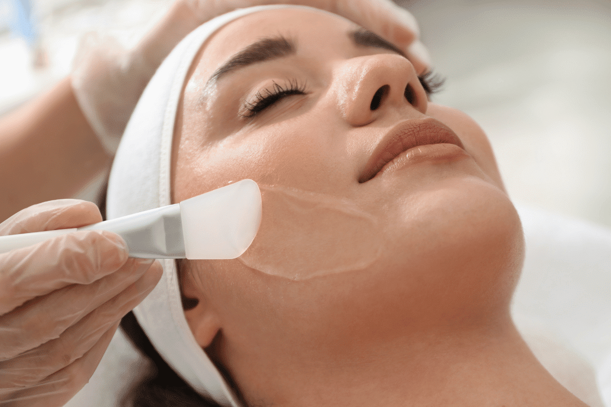 A young woman receiving a chemical peel